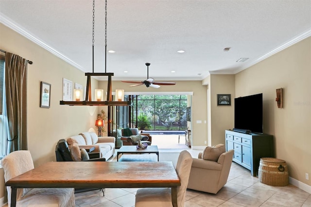 living room with light tile patterned floors, a textured ceiling, ceiling fan, and ornamental molding