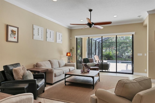 tiled living room featuring ceiling fan, ornamental molding, and a textured ceiling