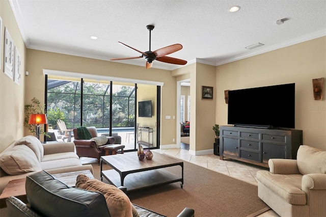 tiled living room featuring a textured ceiling, ceiling fan, and ornamental molding