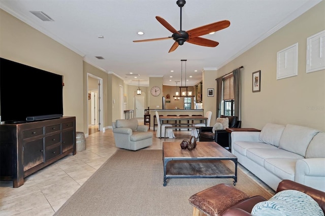 living room featuring light tile patterned floors, ceiling fan, and crown molding