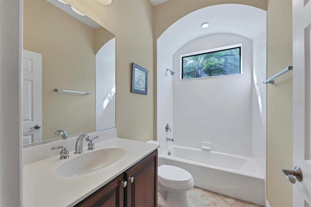 full bathroom with tile patterned floors, vanity, bathtub / shower combination, and toilet