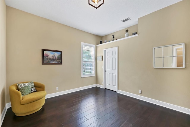 unfurnished room with dark hardwood / wood-style floors