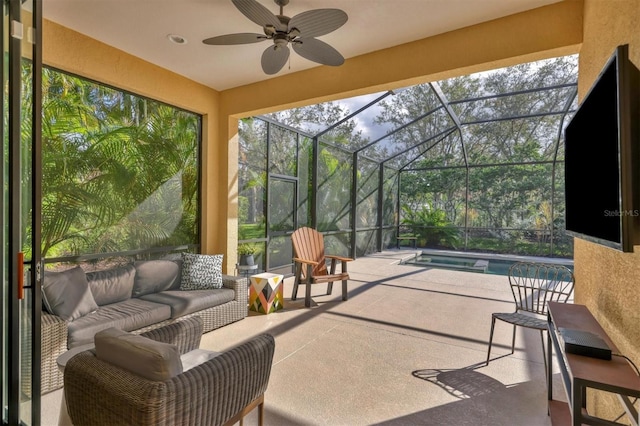 sunroom with ceiling fan and a swimming pool