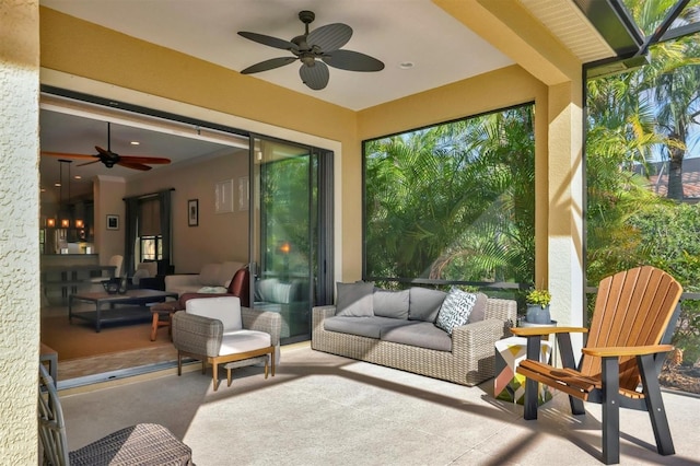 sunroom with ceiling fan