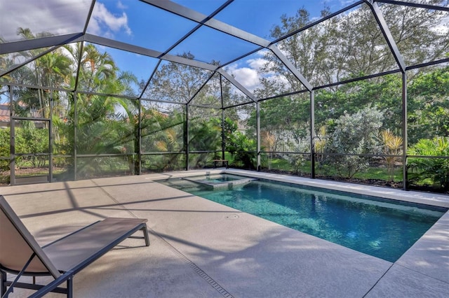 view of pool with a patio area and a lanai