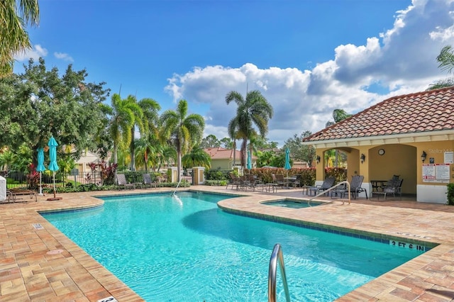 view of swimming pool featuring a patio area