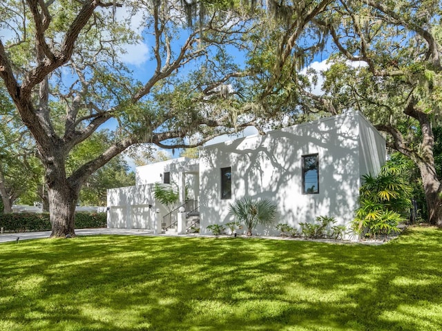 view of home's exterior with a lawn