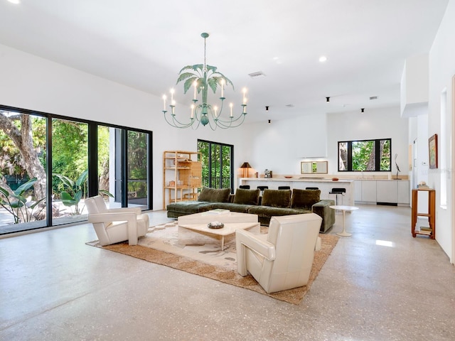 living room with an inviting chandelier