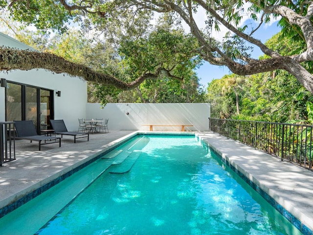 view of pool featuring a patio area