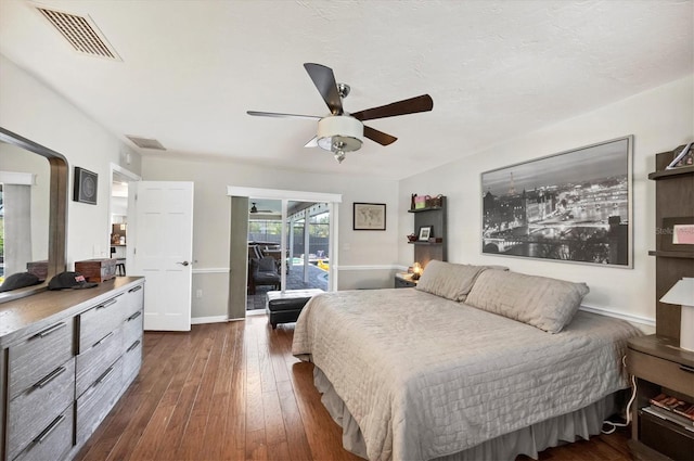 bedroom featuring ceiling fan and dark hardwood / wood-style flooring