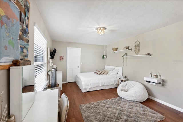 bedroom featuring dark hardwood / wood-style flooring