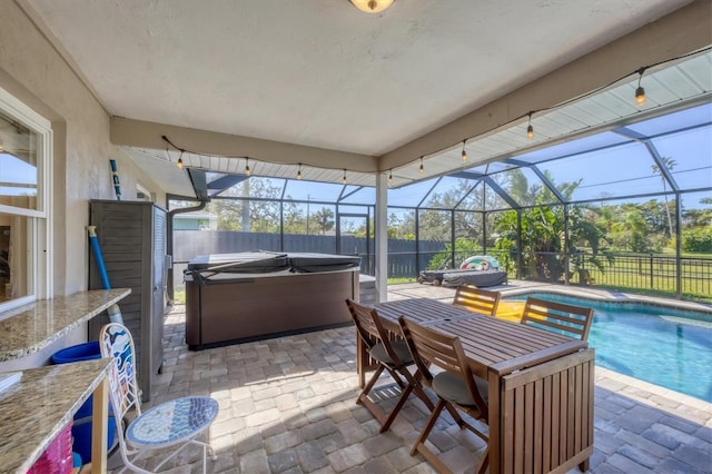 view of patio with a swimming pool with hot tub and a lanai