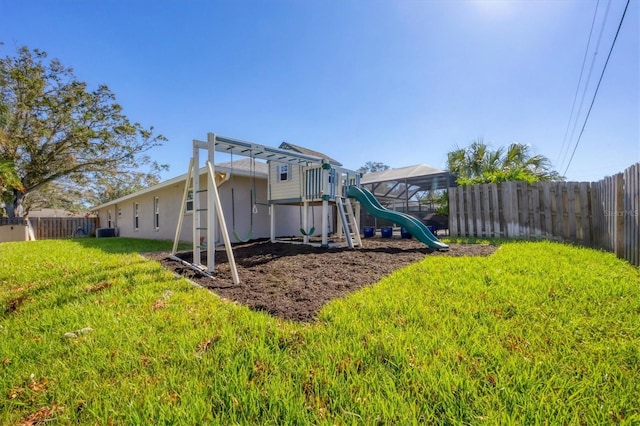 exterior space featuring a playground and central AC unit