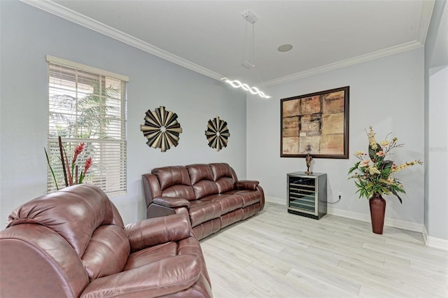 living room featuring ornamental molding and light wood-type flooring