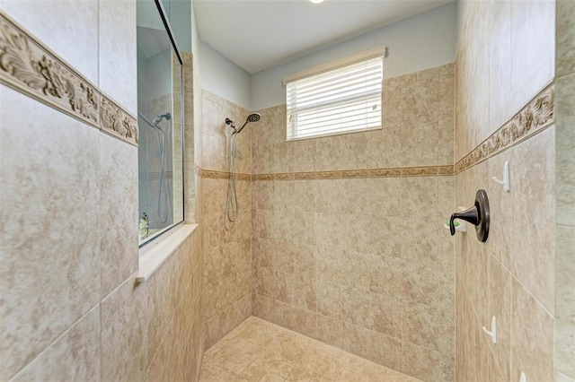 bathroom with tiled shower