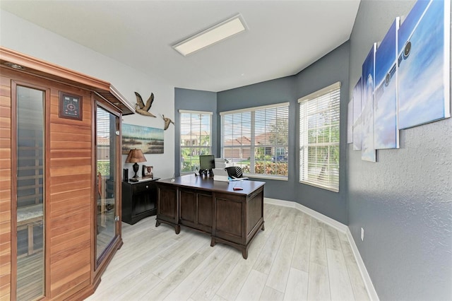 office space featuring light hardwood / wood-style flooring and plenty of natural light