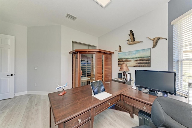 home office with light wood-type flooring