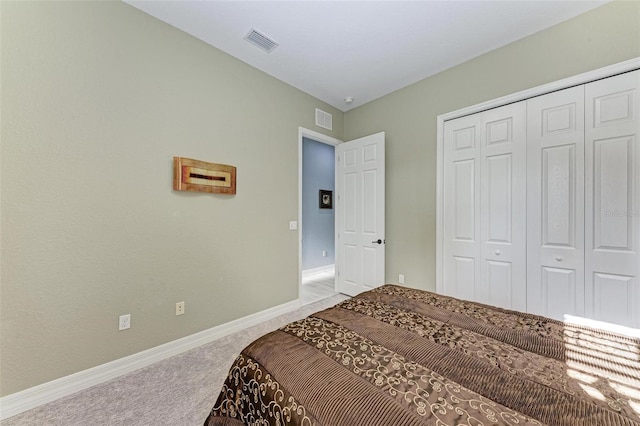 bedroom with a closet and carpet floors