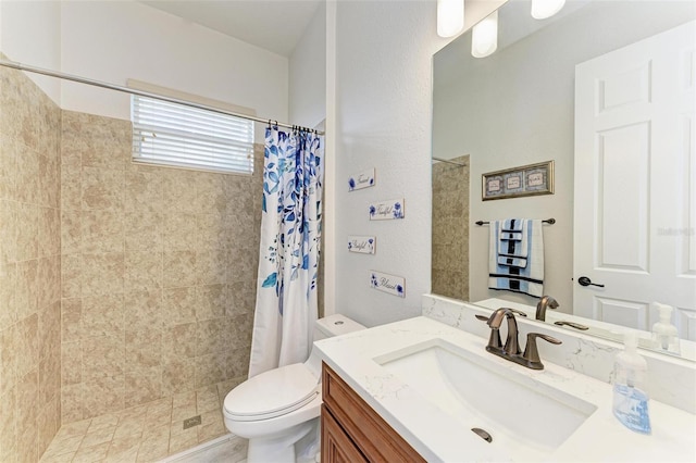 bathroom with walk in shower, vanity, and toilet