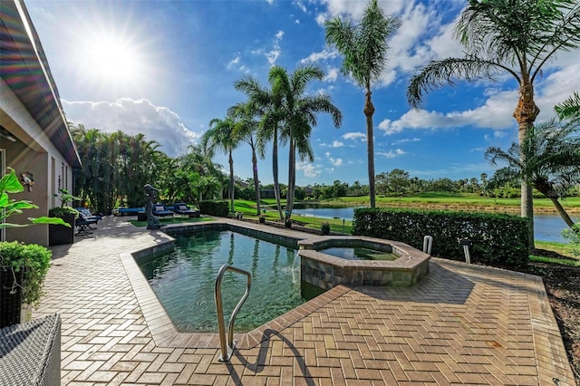 view of swimming pool featuring a patio, an in ground hot tub, and a water view