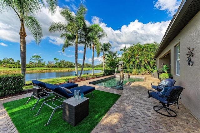 view of patio with a water view