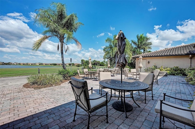 view of patio / terrace with a water view