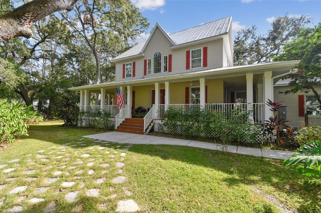 view of front of property featuring a front yard and covered porch