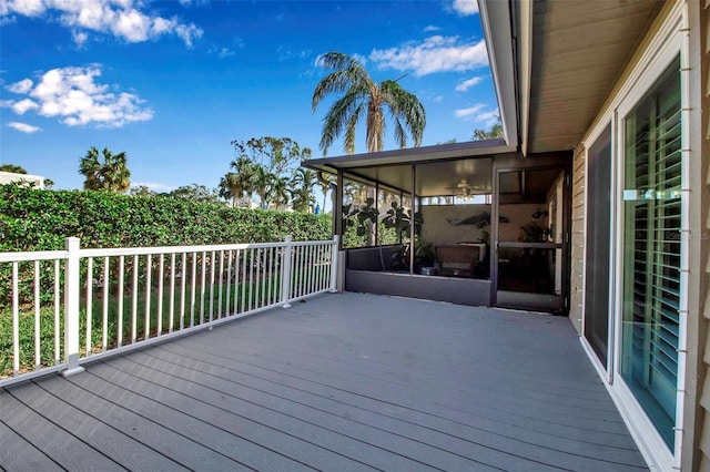 deck with a sunroom