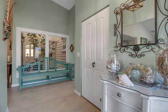 3410 Avenida Madera Unit B, Bradenton, FL 34210 - bathroom featuring lofted ceiling, baseboards, and tile patterned floors