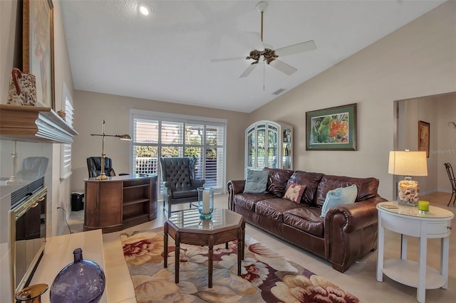 living room with ceiling fan and lofted ceiling