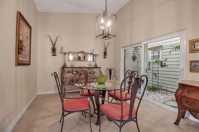 dining room featuring lofted ceiling and a notable chandelier