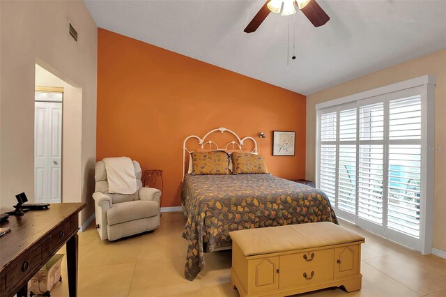3410 Avenida Madera Unit B, Bradenton, FL 34210 - bedroom featuring lofted ceiling, light tile patterned flooring, baseboards, and a ceiling fan