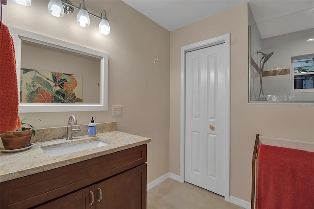 bathroom featuring a shower, vanity, and tile patterned floors