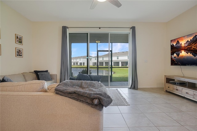 bedroom with access to outside, ceiling fan, and light tile patterned flooring