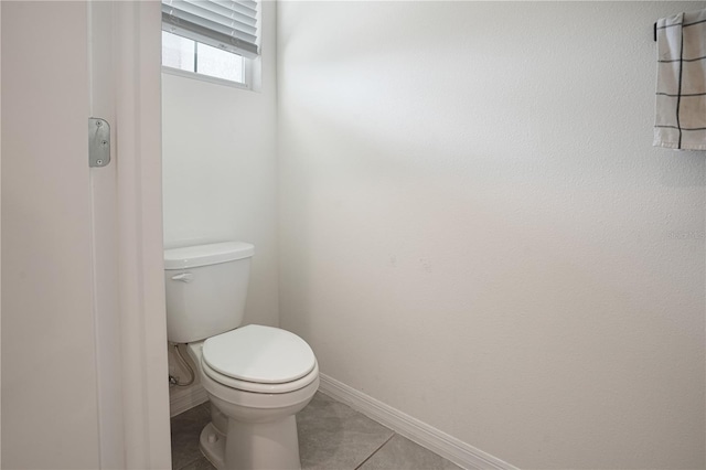 bathroom featuring toilet and tile patterned floors