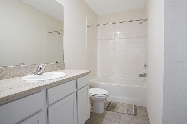 full bathroom featuring shower / washtub combination, tile patterned flooring, vanity, and toilet