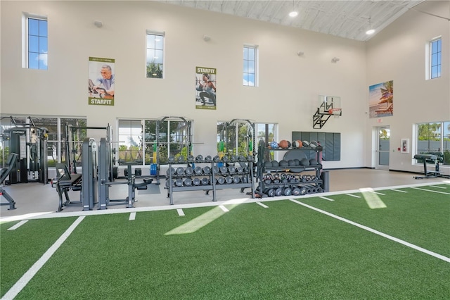 gym with a towering ceiling