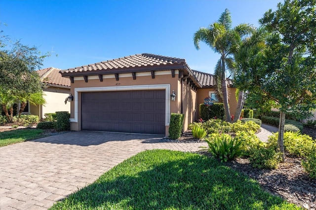 mediterranean / spanish-style house featuring a garage