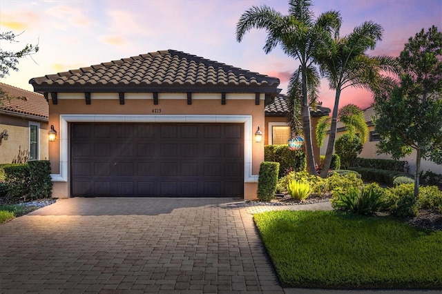 mediterranean / spanish-style home featuring a garage