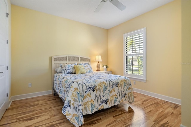 bedroom with ceiling fan and light wood-type flooring