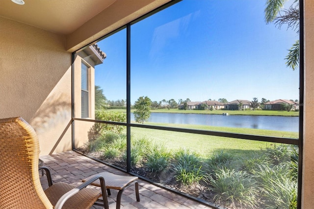 sunroom with a water view