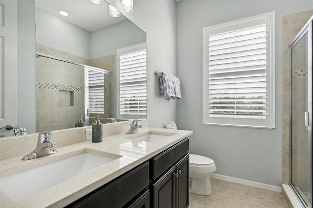 bathroom with toilet, walk in shower, tile patterned floors, and vanity