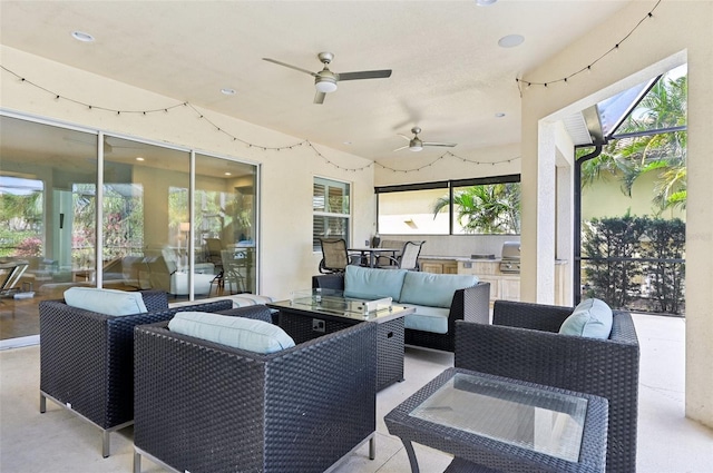 view of patio featuring ceiling fan, area for grilling, a grill, and an outdoor hangout area