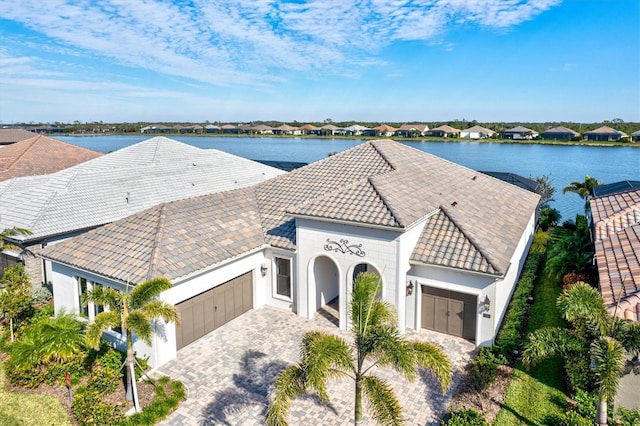 birds eye view of property featuring a water view