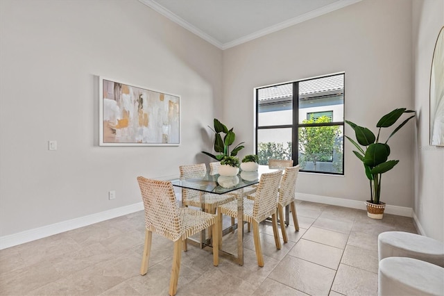 tiled dining space featuring ornamental molding