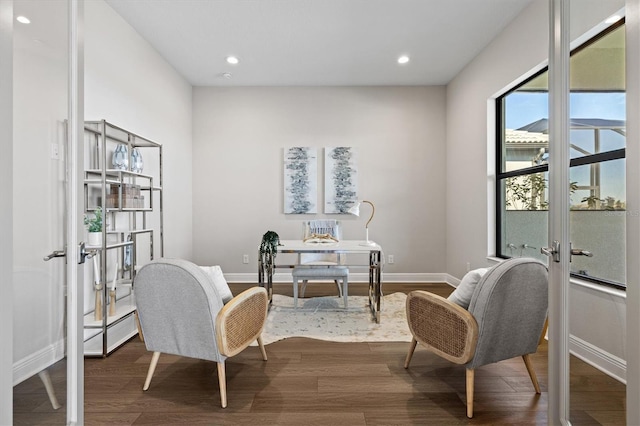 sitting room featuring french doors and dark hardwood / wood-style flooring