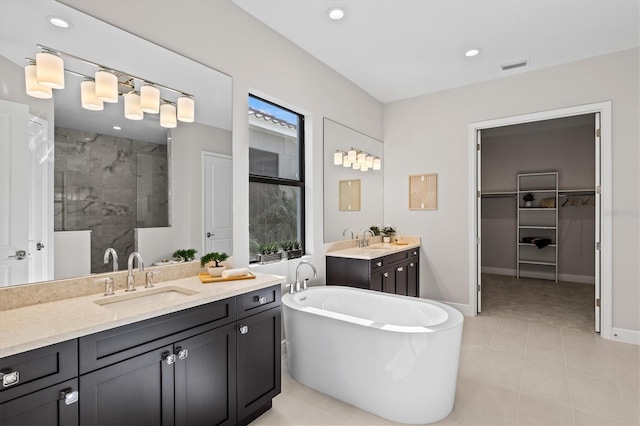 bathroom featuring shower with separate bathtub, vanity, and a wealth of natural light