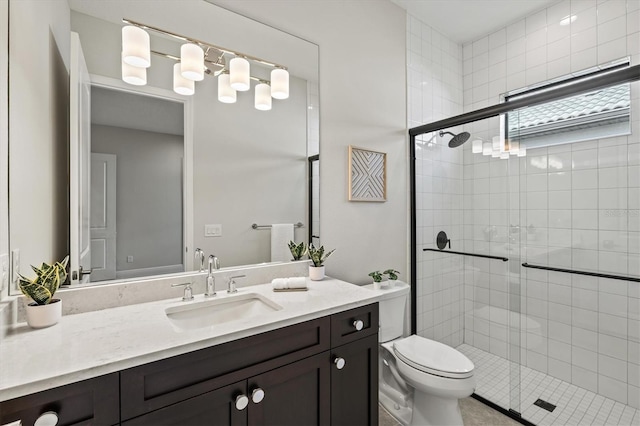 bathroom with vanity, toilet, and walk in shower