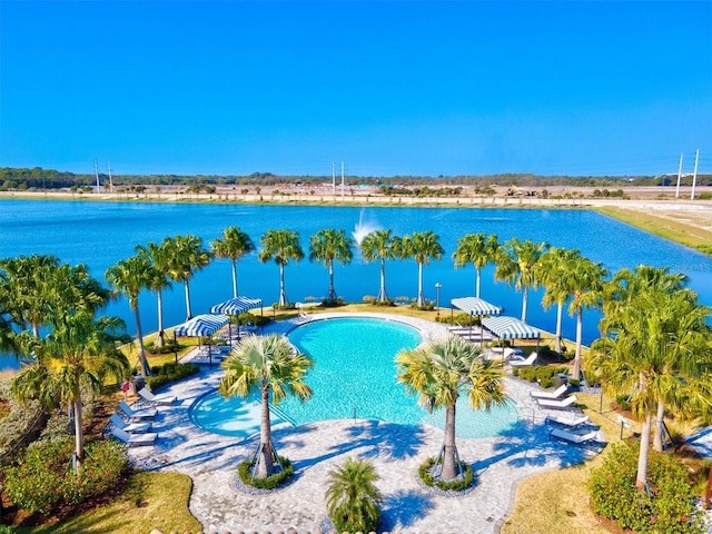 view of swimming pool featuring a water view