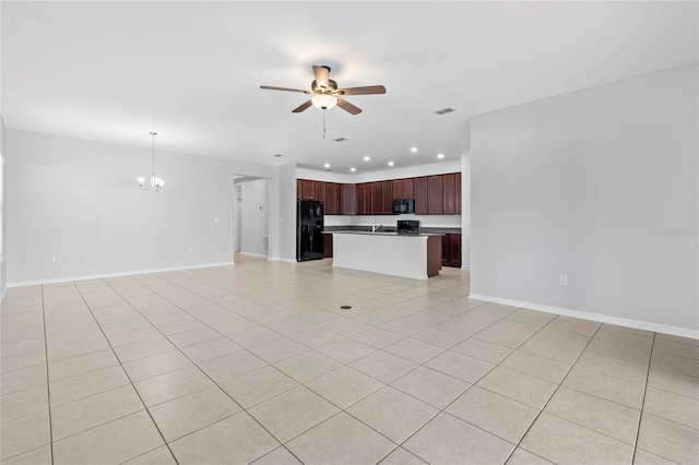 unfurnished living room featuring ceiling fan with notable chandelier and light tile patterned floors